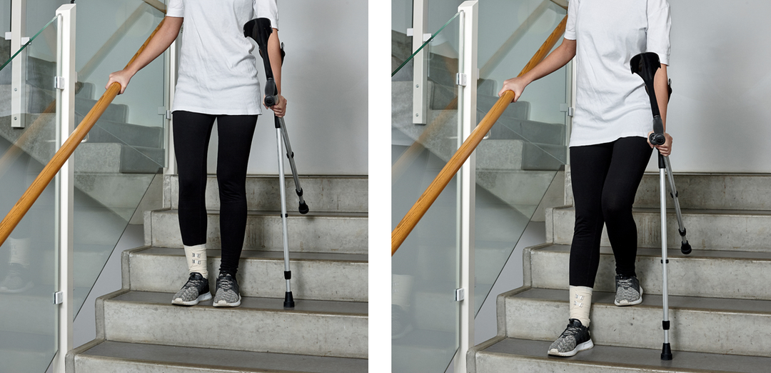 Picture of a person walking down the stairs with crutches