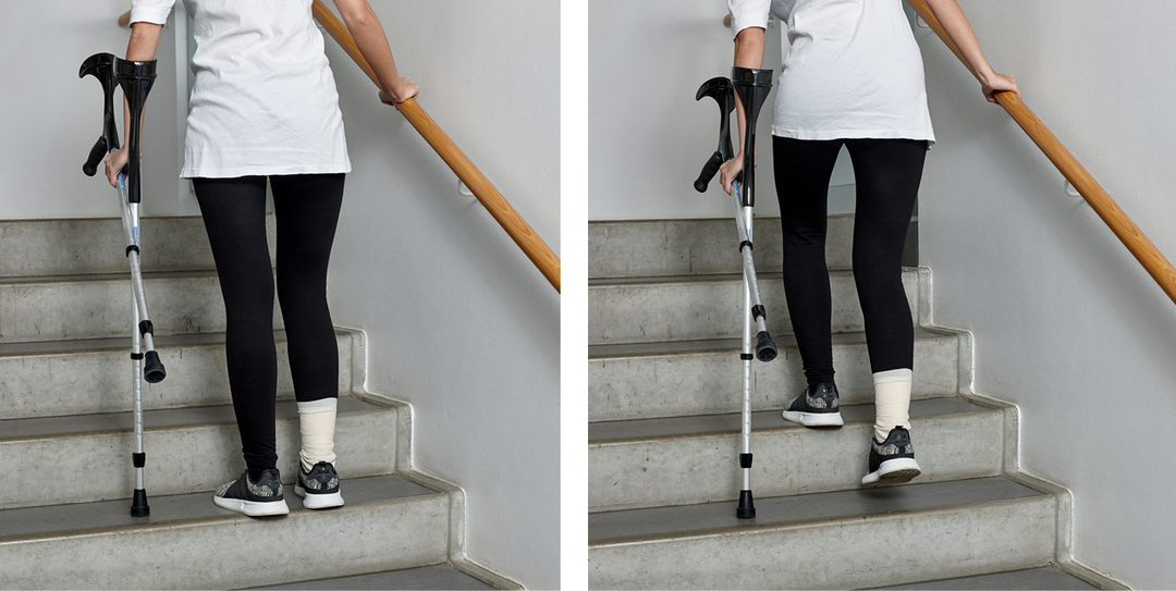 Picture of a person walking up the stairs with crutches