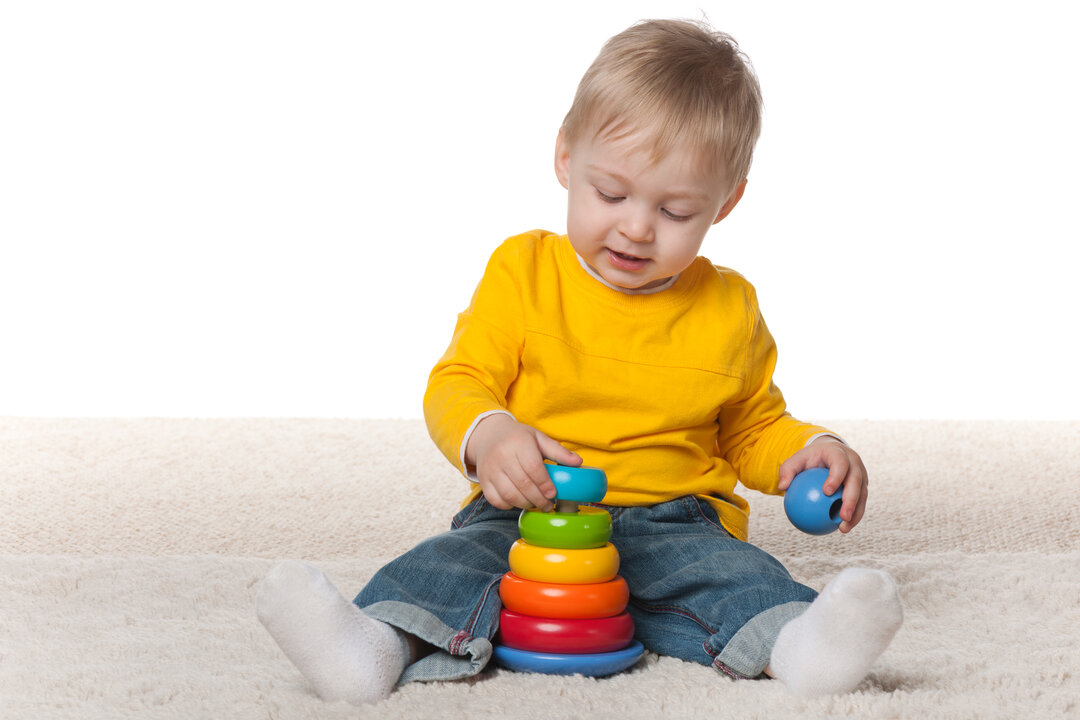 The pictures shows a child playing with toys